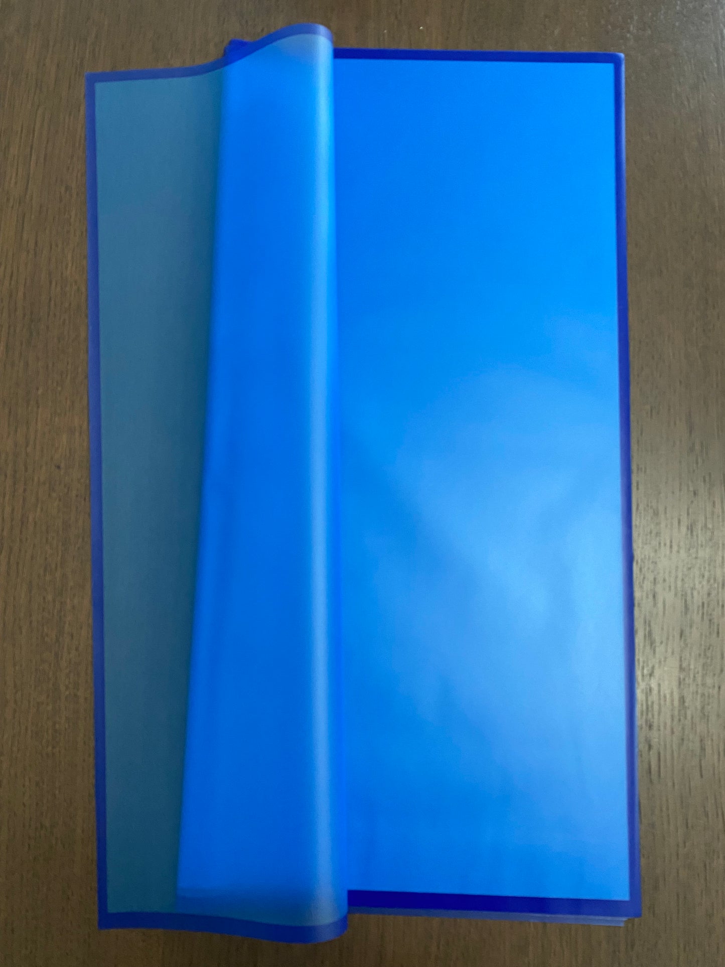 Sheer royal blue wrapping with blue border